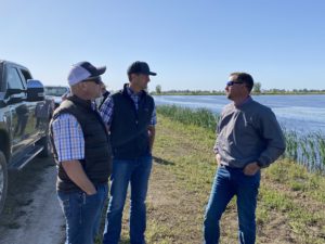 Grow West President + CEO Ernie Roncoroni (left) and Vice President + COO Lucas Schmidt (middle) touring waterbird habitat projects with Hans Herkert (right). Photo courtesy of Paul Buttner.