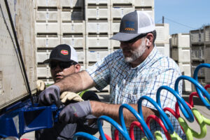 Grow West Trucking Operations Supervisor Matt Freitas prepping a truckload with Del Monte employee