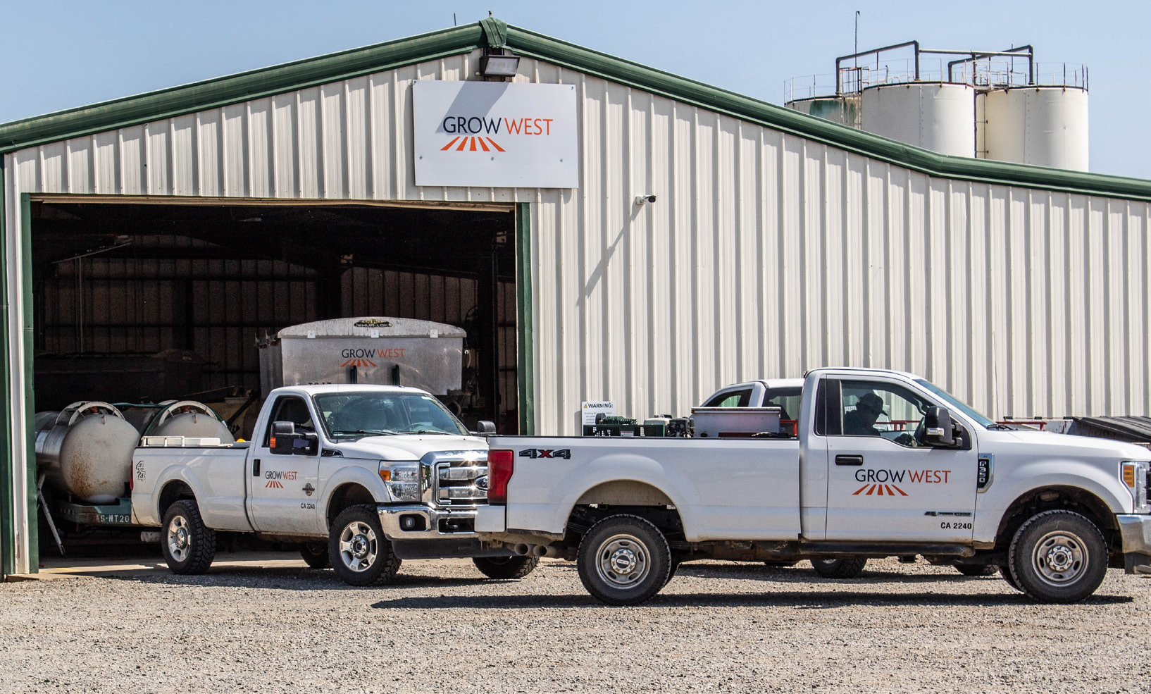 grow west building and trucks